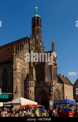 Market in the square in front of the church of our lady, nuremberg. Stock Photo