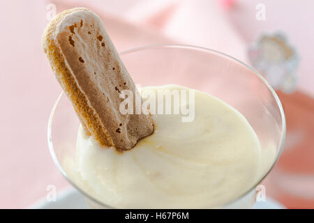 Zabaione, Italian dessert made of egg yolks, sugar, and Marsala wine served with sponge finger biscuits Stock Photo