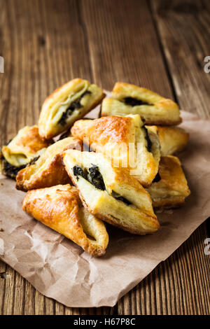 Spinach and cheese puff pastries triangles Stock Photo