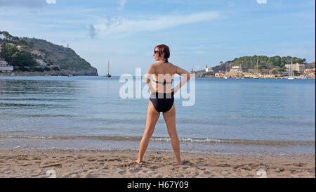 A woman in her late forties on a beach in Soller, Majorca Stock Photo