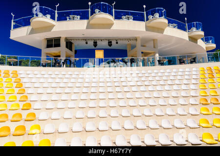 Plastic seats in an amphitheatre style outdoor theatre Stock Photo
