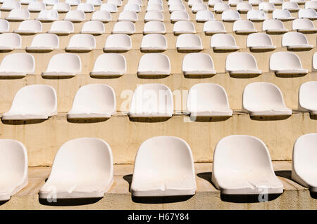 Plastic seats in an amphitheatre style outdoor theatre Stock Photo