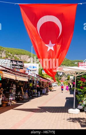 Turkish flag flying above the street in Oludeniz, Turkey Stock Photo