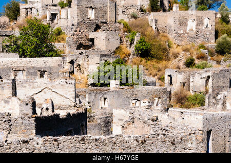 Ruins at the former Greek village of Kayakoy in Turkey, abandoned 1922, now a museum and also known as the Ghost Town. Stock Photo
