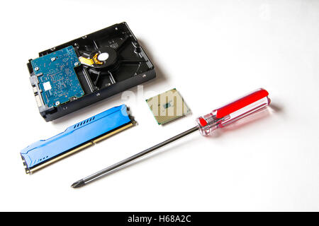 Computer components on a white background. CPU, HDD, DDR RAM, screw-driver Stock Photo