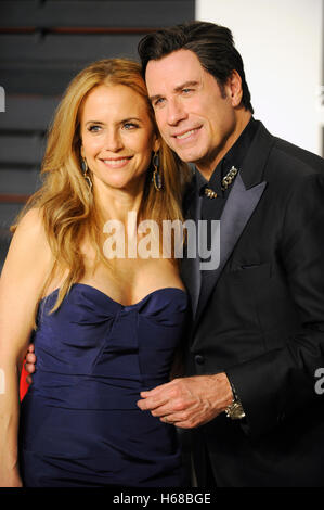 Actor John Travolta and Kelly Preston (l) attend the 2015 Vanity Fair Oscar Party hosted by Graydon Carter at Wallis Annenberg Center for the Performing Arts on February 22nd, 2015 in Beverly Hills, California. Stock Photo