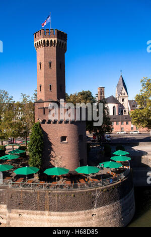 Germany, Cologne, the Malakoff tower at the Rheinau harbour, in the background the church Sankt Maria Lyskirchen. Stock Photo