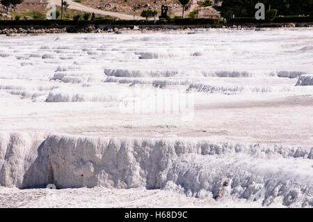 Terraced travertines at the thermal springs pools water at Pamakkule, Turkey Stock Photo