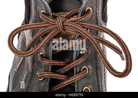 Lace, tied in bow on a new shoe, isolated on white background Stock Photo