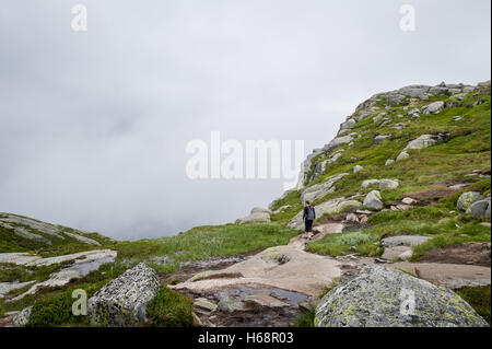 Woman hiker on the way to Kjerag. Norway nature. Stock Photo