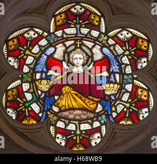 ROME, ITALY - MARCH 9. 2016: The angel with the symbolic crowns on the stained glass rosette of All Saints' Anglican Church Stock Photo