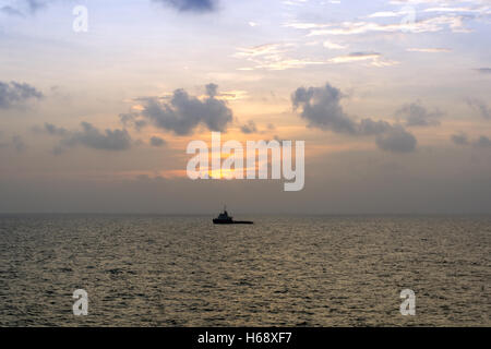 silhouette of a supply vessel Stock Photo