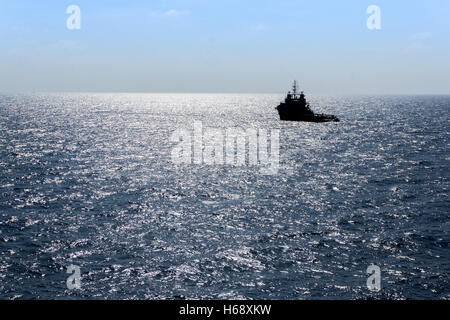 silhouette of a supply vessel Stock Photo