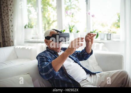 Senior man wearing virtual glasses Stock Photo