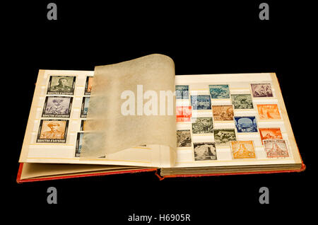 Two pages of old album with old historical Bulgarian post stamps, Isolated, clipping path included. Stock Photo