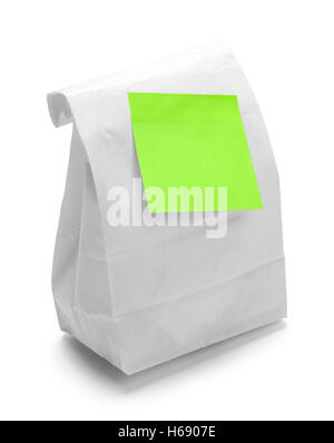 Sack Lunch with Green Sticky Note Isolated on White Background. Stock Photo