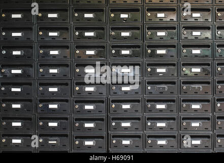 Many Black color mailboxes on wall Stock Photo