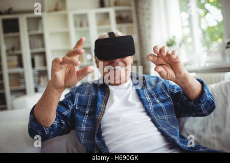 Senior man wearing virtual glasses Stock Photo