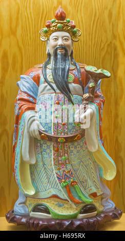 AVILA, SPAIN, APRIL - 18, 2016: The chinese porcelain Famille Rose figure of Tao Lucky Gods (Prosperity - Fu) Stock Photo