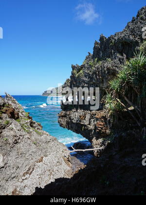 Eroded limestone cliff that looks like monster mouth on the coast of Rurutu island, Pacific ocean, Austral, French Polynesia Stock Photo