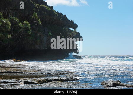 Eroded limestone cliff that looks like a monster head on the coast of Rurutu island, Pacific ocean, Austral, French Polynesia Stock Photo