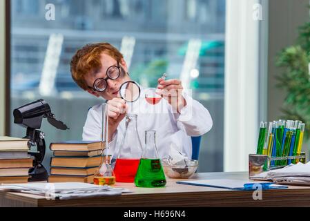 Young crazy chemist working in the lab Stock Photo