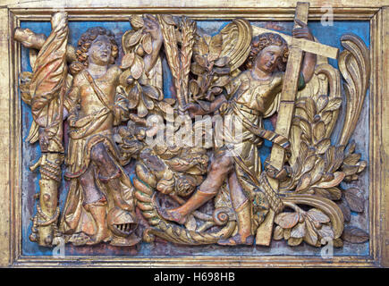 BRESCIA, ITALY - MAY 23, 2016: The polychrome baroque relief of angels withe the cross Stock Photo