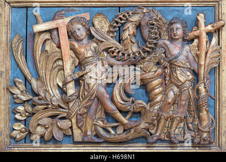 BRESCIA, ITALY - MAY 23, 2016: The polychrome baroque relief of angels withe the cross Stock Photo