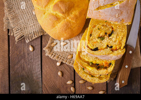 Fresh homemade pumpkin bread and pumpkin slices and olives. Top view Stock Photo