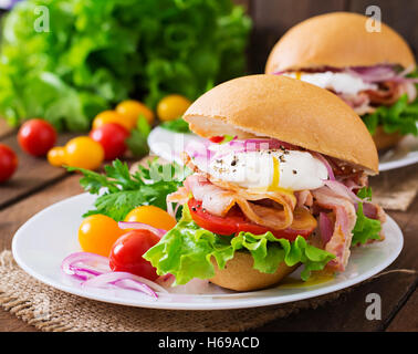 Sandwich with bacon and poached egg Stock Photo