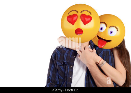 Portrait of an emoji head man and woman. Emoji and love concept. Isolated white background. Stock Photo