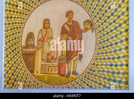 The ancient mosaic shows the Roman actors with masks of tragedy and comedy in process of repetition Stock Photo