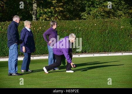 People playing bowls in a park. Stock Photo