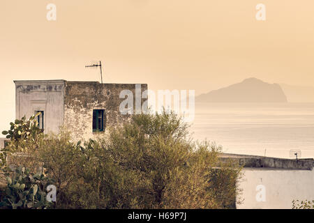 Stromboli, Aeolian islands/Italy – September 19th, 2016. Ginostra typical house with aeolian islands in background at the sunset Stock Photo