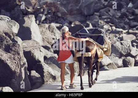 Ginostra, Aeolian islands/Italy – September 19th, 2016. A man transport the luggage up to the Ginostra village with a Mule. Stock Photo
