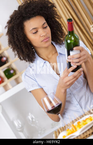 young woman tasting wine in cellar Stock Photo