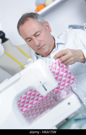 tailor with sewing machine Stock Photo