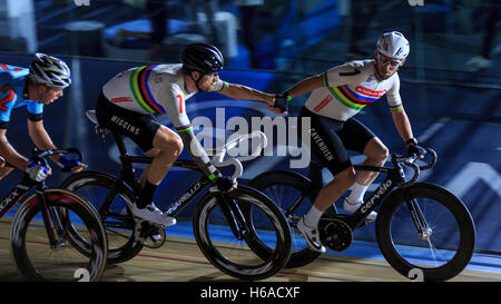 Lee Valley VeloPark, London, UK. 25th Oct, 2016. First day of Six Day London. Sir Bradley Wiggins (left) and Mark Cavendish (right) perform a 'hand sling' during the six day cycling competition centred around the Madison - the event in which the British pair are world champions. This will be the last event that Wiggins competes in in the UK. Credit:  Clive Jones/Alamy Live News Stock Photo