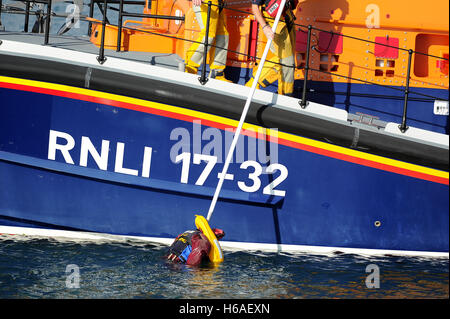 RNLI Lifeboat practice a man overboard rescue exercise, Weymouth, Dorset, UK Stock Photo