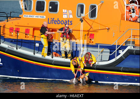 RNLI Lifeboat practice a man overboard rescue exercise, Weymouth, Dorset, UK Stock Photo