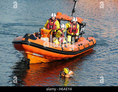 RNLI Lifeboat practice a man overboard rescue exercise, Weymouth, Dorset, UK Stock Photo