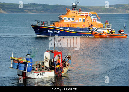 RNLI Lifeboat practice a man overboard rescue exercise, Weymouth, Dorset, UK Stock Photo