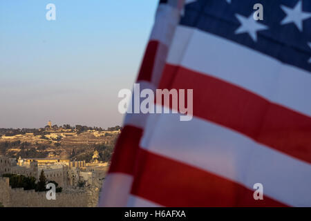 Jerusalem, Israel. 26th October, 2016. The American flag flies over the Old City overlooking the Al Aqsa Mosque on Temple Mount as Republicans Overseas Israel hold a rally for the presidential campaign of Donald Trump outside the Old City Zion Gate. Calling the event 'Jerusalem Forever' speakers voiced support for Jewish Jerusalem including the screening of a prerecorded video by Donald Trump in which Trump voiced his respect for the Jewish people. An estimated 200,000 eligible American voters reside in Israel. Credit:  Nir Alon/Alamy Live News Stock Photo