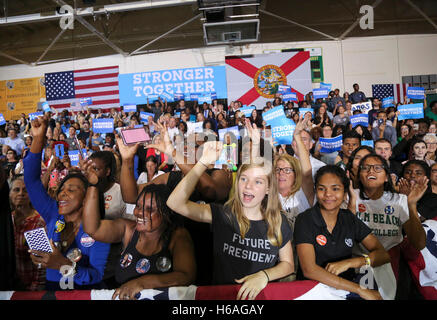 Florida, USA. 26th Oct, 2016. Hillary Clinton supporters -- including Elle Buckley of Delray Beach (center), who is wearing a ''Future President'' t-shirt -- listen and cheer as Clinton speaks at an early voting rally at the Elisabeth W. Erling Gymnasium at Palm Beach State College in Lake Worth Wednesday, October 26, 2016. Credit:  Bruce R. Bennett/The Palm Beach Post/ZUMA Wire/Alamy Live News Stock Photo