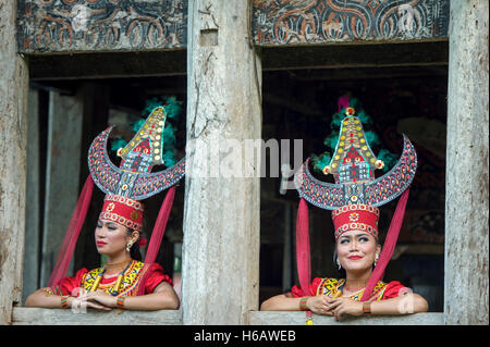 Toraja traditional dancer pose for camera with colourful traditional costume. The dance called Sanda Oni. Stock Photo