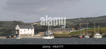 View of the RNLI lifeboat station (left) and yacht storage facilities at Baltimore, County Cork, Ireland. Stock Photo