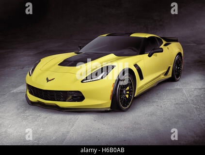 License and prints at MaximImages.com - Yellow 2016 Chevrolet Corvette Z06 coupe luxury sports car super car on gray concrete background with clipping Stock Photo