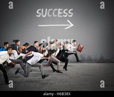 successful business team running in the office hall Stock Photo - Alamy
