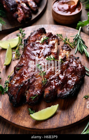 Bbq, grilled pork ribs on wooden board Stock Photo