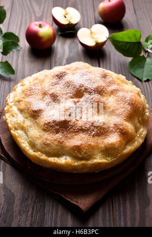 Fruit baking apple pie on wooden table Stock Photo